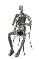 Metalowa figurka srebrna Muzyk grający na trąbce